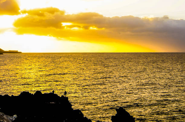 Sun is setting over by the sea.\nIstanbul - Turkey.
