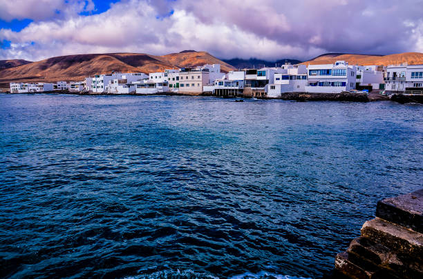 istock A beautiful blue ocean with a town in the background 2193398268