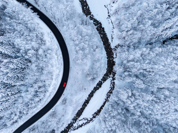 istock Aerial view on winter landscape with a road beside a river 2193400066