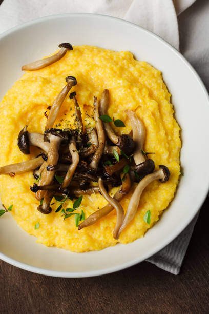 istock Creamy polenta with roasted shimeji mushrooms. 2193407925