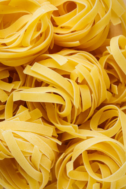 istock Raw fettuccine pasta nests. 2193407953