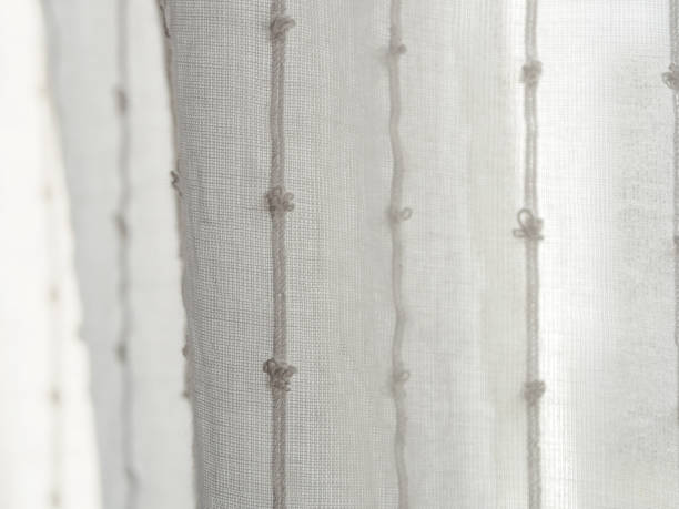 istock A close-up of a light translucent fabric that plays with the sun's rays, creating a feeling of lightness and airiness 2193412690
