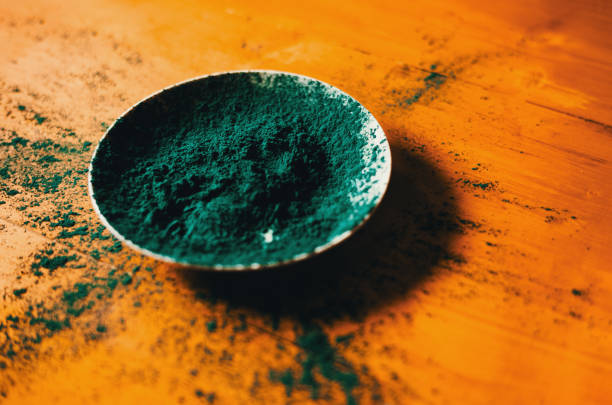 Spirulina powder in a white dish