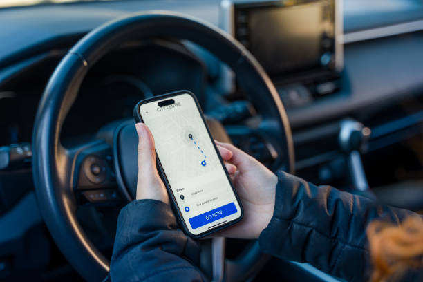 istock Woman using navigation app on smartphone in car 2193413979