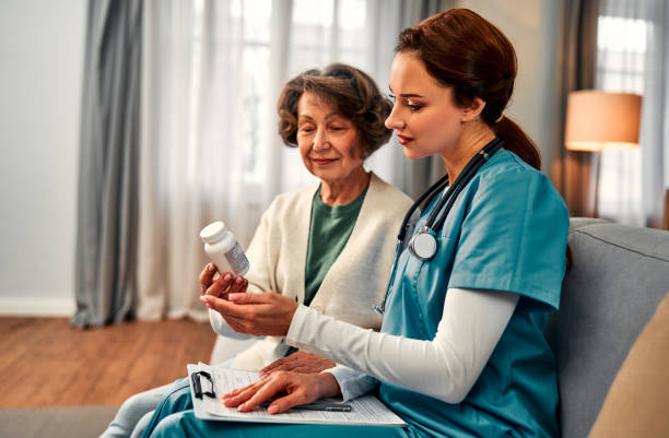 istock A young female doctor sits with an elderly patient, prescribing medication. 2193416794