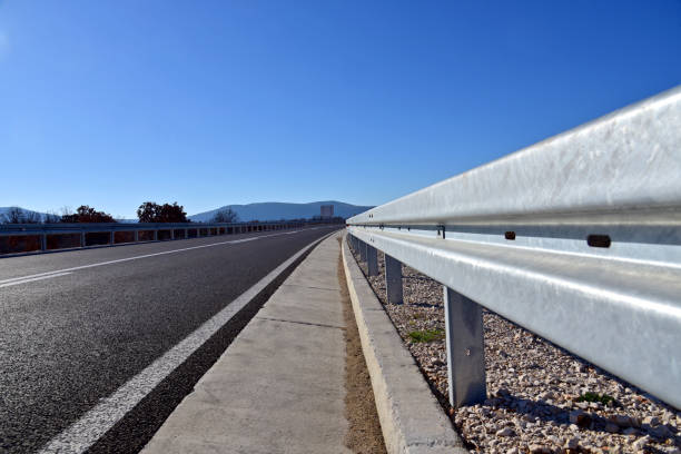 New metal guardrail standing next to the highway