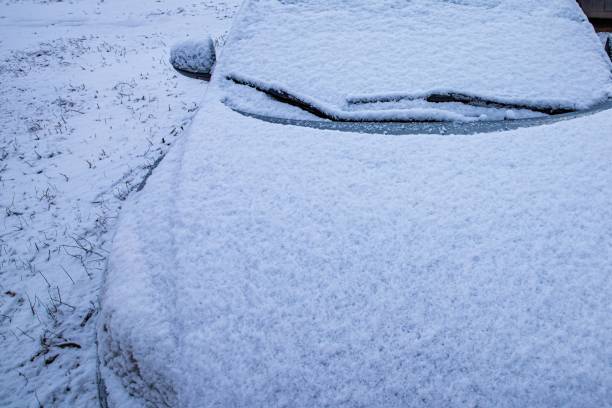 istock Snow-Covered Car Completely Blanketed with Fresh Snow 2193419447