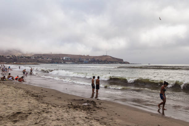 Salvador, Bahia, Brazil - September 17, 2025: Bathers are seen taking a breather at PaciÃªncia Beach during a sunny day in Salvador, Bahia.