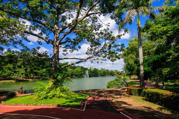 Water jet and running track around the natural lagoon of La Polvora, Public Park in Villahermosa, Tabasco State.