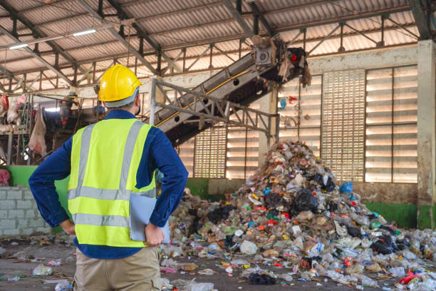 istock Behind is an environmental engineer checking the sorting of waste at a waste sorting plant. 2193422228