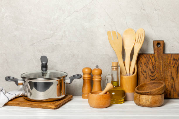istock Stainless steel saucepan on light kitchen background. Modern saucepan. Kitchenware. Cooking pot. Cooking concept. Mockup. Space for text. Copy space. 2193427563