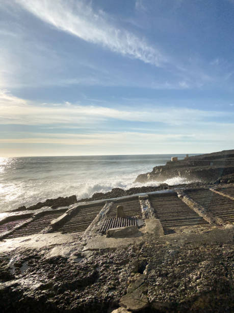 istock Coastal view with waves crashing on rocky shore 2193429458