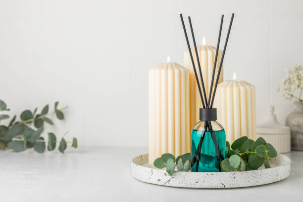 istock Aromatic reed air freshener on wooden table.Diffuser with natural fruity, floral, spicy aroma.interior scent. Luxury perfume for the home.Orange, lime, coffee, cinnamon, star anise, vanilla and orchid 2193429708