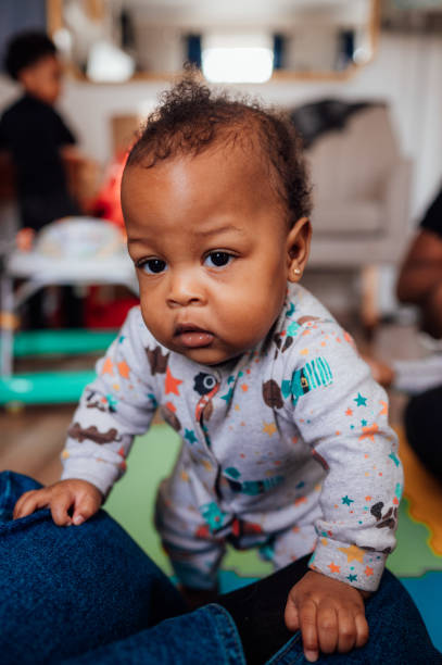 istock Toddler trying to stand up 2193429992