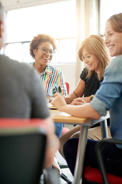 istock Unposed group of creative business people in an open concept office brainstorming their next project. 2193431782