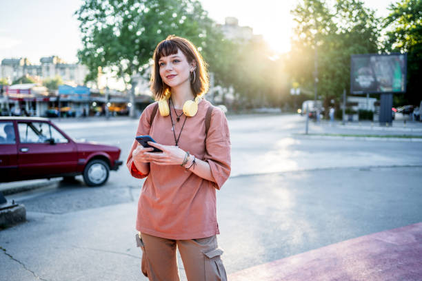 istock Woman using phone in the city 2193433569