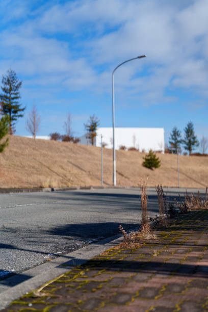 istock A Serene Urban Roadscape Under the Clear Blue Sky 2193433900