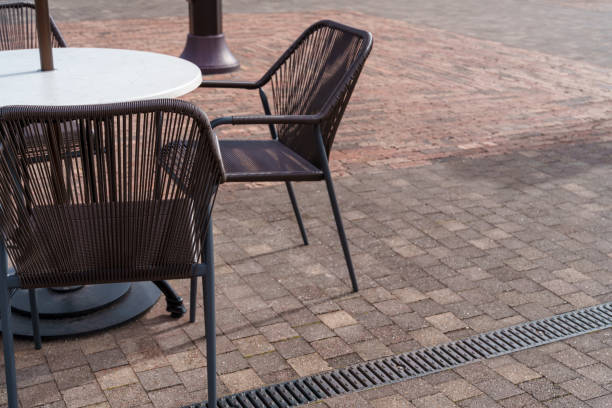 istock Relaxing Open-Air Cafe Space with Modern Table and Chairs 2193434924