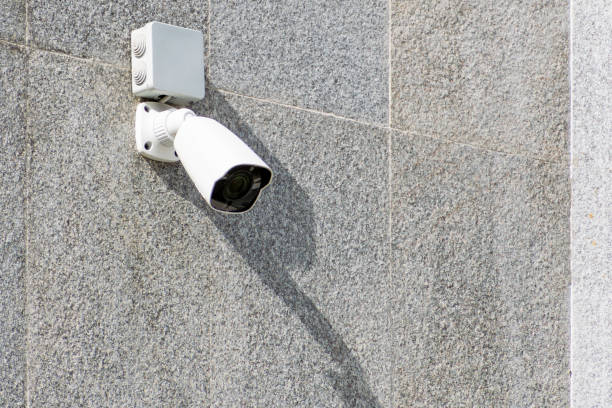 istock outdoor surveillance camera on concrete wall 2193435516