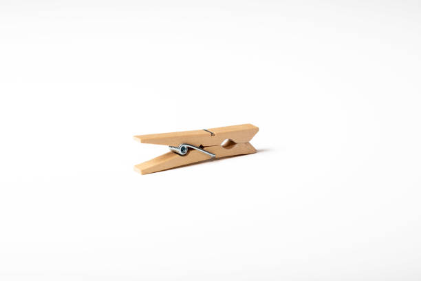 Clothespins attached to a utility rope against a blurred background, offering ample copy space.