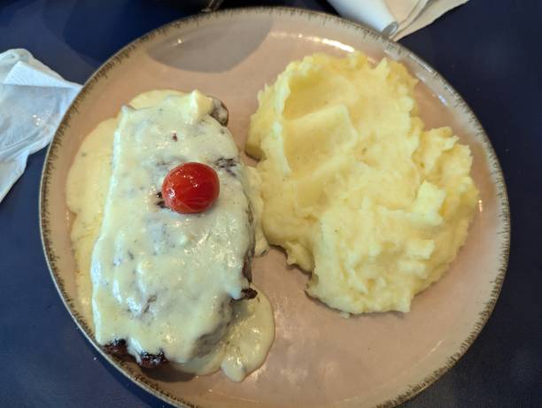 istock Sirloin steak, onions and mashed potatoes with cheese 2193437792