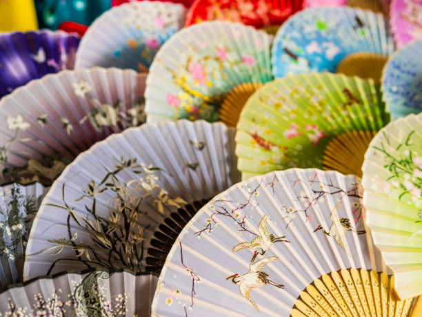 istock Colorful market stall with handmade folding paper fans, China 2193440121