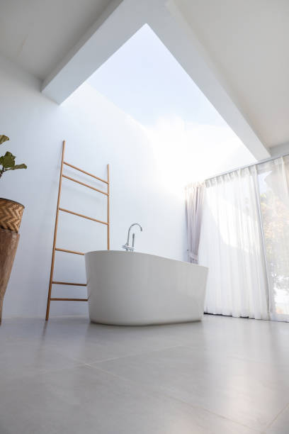istock Modern Minimalist Bathroom with Freestanding Tub and Natural Light 2193442164