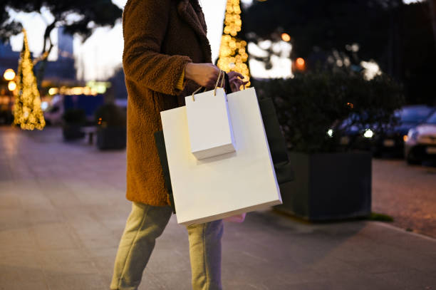 istock Woman carrying shopping bags. 2193444902