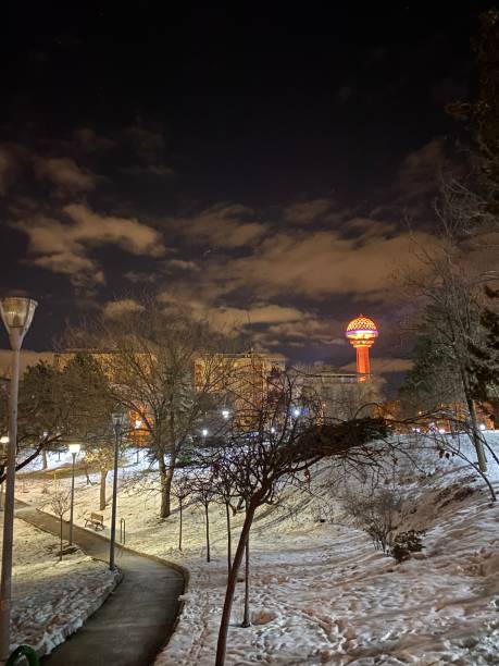 istock Snowy evening at a park with Atakule view 2193446159