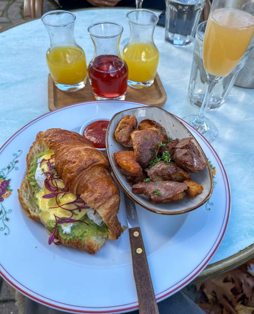 istock Brunch Croissant Sandwich Potatoes Mimosa At Restaurant Table 2193447365