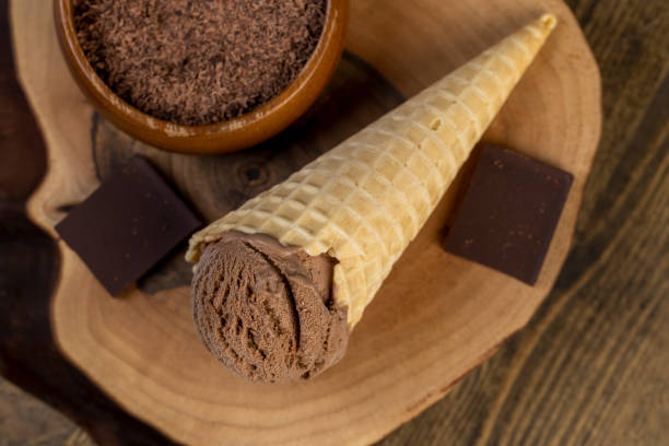 istock chocolate ice cream in a cone on a board 2193448871