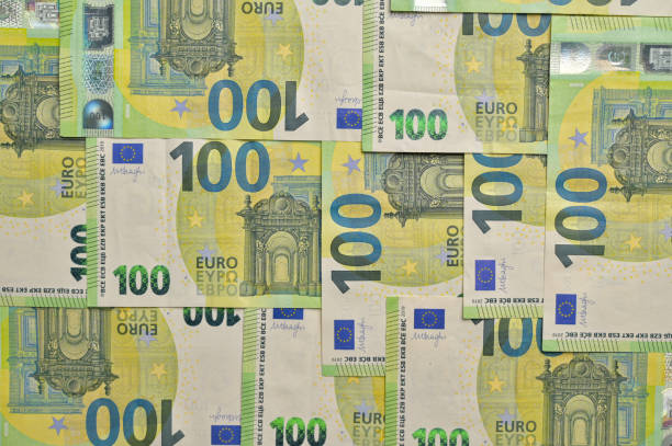 istock Top view 100 Euro paper cash banknotes. Copy space background, wallpaper, cover, backdrop, texture. Place for adding text or design 2193448896
