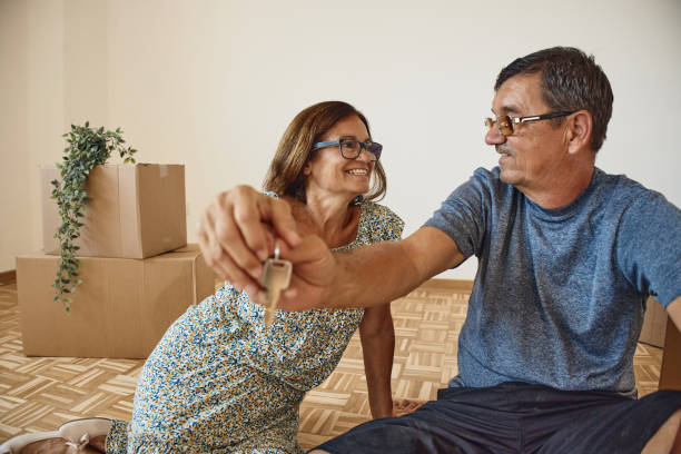 istock Senior couple moving into new home 2193449236