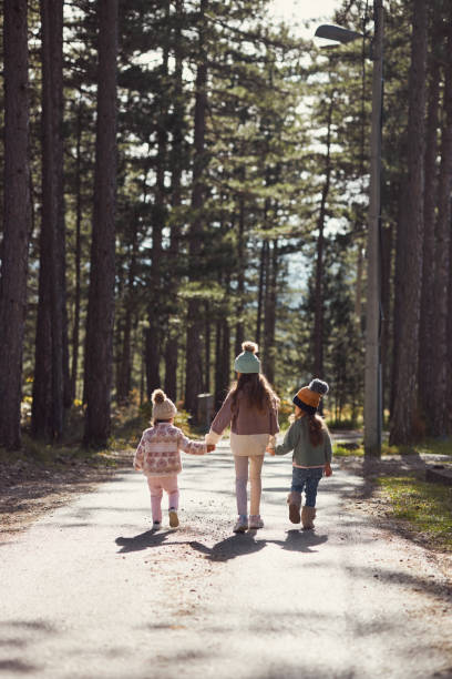 istock Happy children enjoying autumn in forest 2193451914