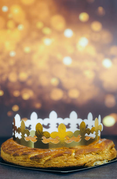 istock Fresh almond royal galette with crown on table with bokeh. 2193453982