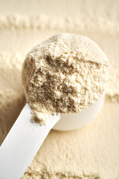 istock Whey protein powder in a plastic measuring cup 2193455726