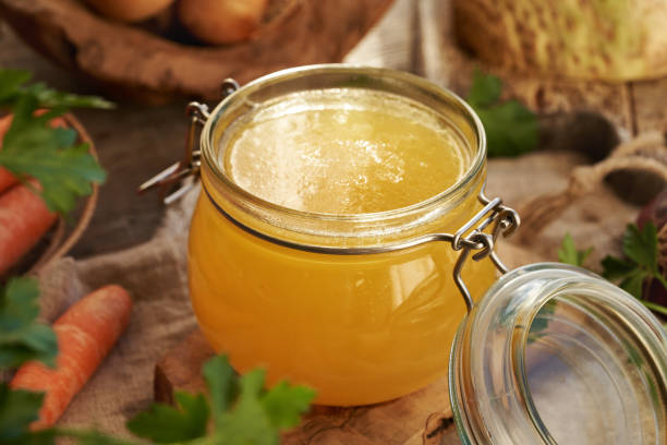 istock Bone broth in a glass jar with carrots, parsley and onions 2193455781