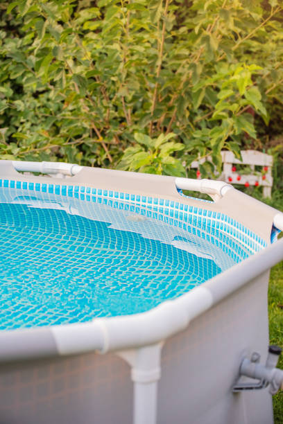 istock Frame pool with clean water for swimming in the garden. 2193455934