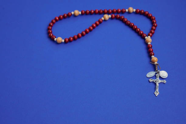 istock Rosary beads on a blue background for prayer and meditation experience 2193457612
