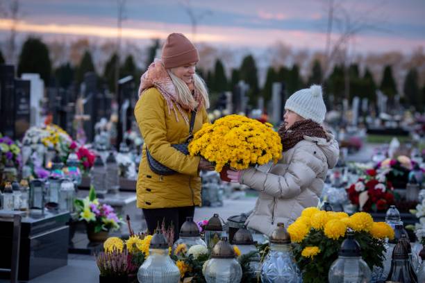istock Remembering Our Cherished Loved Ones Taking a Peaceful Visit to the Cemetery with Beautiful Flowers 2193458330