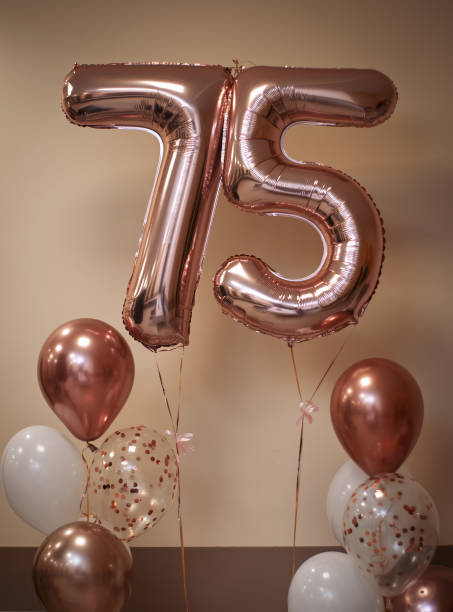 istock pink balloons number seventy five 2193459311