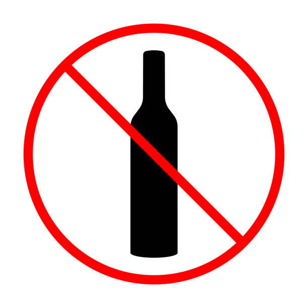 istock Prohibited alcohol consumption sign. Vector illustration of bottle with red prohibition circle and slash, symbolizing no drinking allowed 2193459422