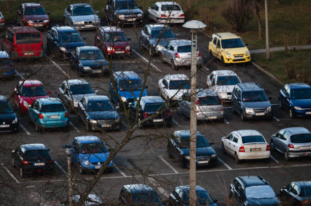 istock Crowded parking lot with various cars 2193461122