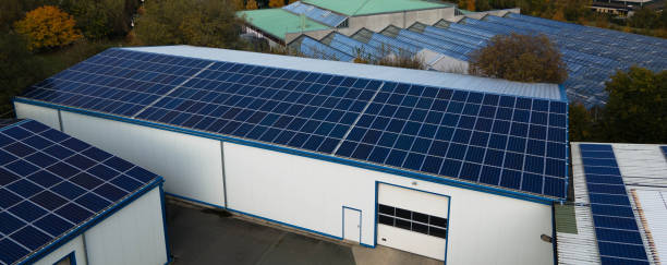 istock Expansive Solar Panel Arrays on Industrial Facility Roofs 2193462952