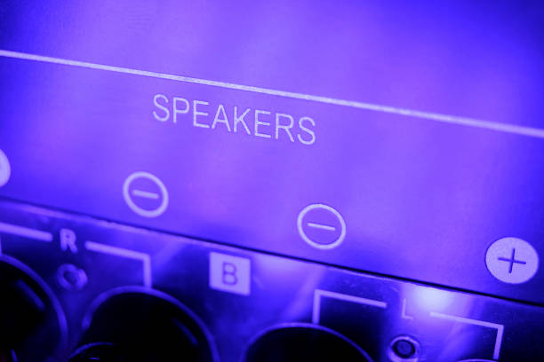 oblique view with focus on the membrane of the loudspeaker of a modern wlan and bluetoth controlled multimedia loudspeaker box