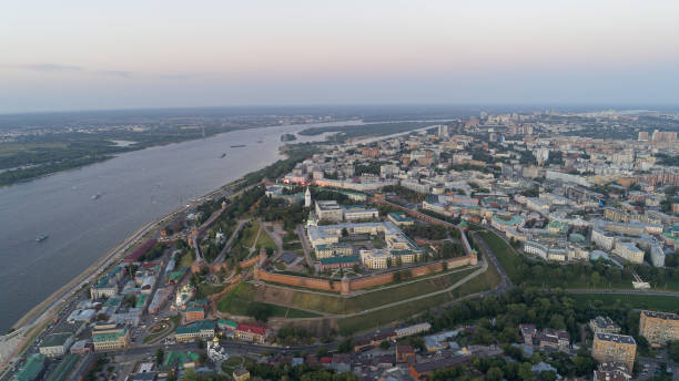 City with a river running through it City with a river running through it. The city is full of buildings and has a lot of traffic. Nizhny Novgorod russia city spring stock pictures, royalty-free photos & images