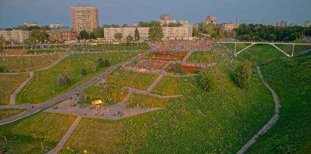 istock Park with a hill and a bridge in the background 2193465015
