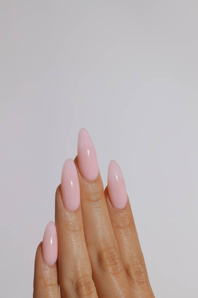 istock female hands with manicure, a neat almond manicure 2193470567