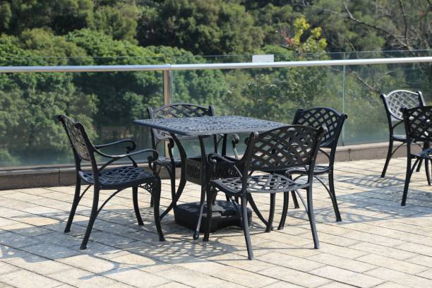 istock A black patio set with a table and four chairs 2193472697
