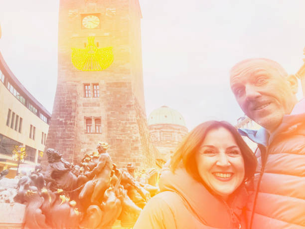 Nuremberg Altstadt. Couple posing in lomo style photo. Lomo photograhy is a technique that emulates old-style, especially Russian-made cameras. Lens and color distortions are the prominent features of this technique.